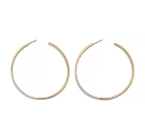 Minimalist, lightweight, mixed metal hoops of 14k yellow gold and sterling silver hand-forged wire, with 14k gold earring posts. Size large, two and one-eighth inches in diameter. Hand-crafted in Portland, Oregon.
