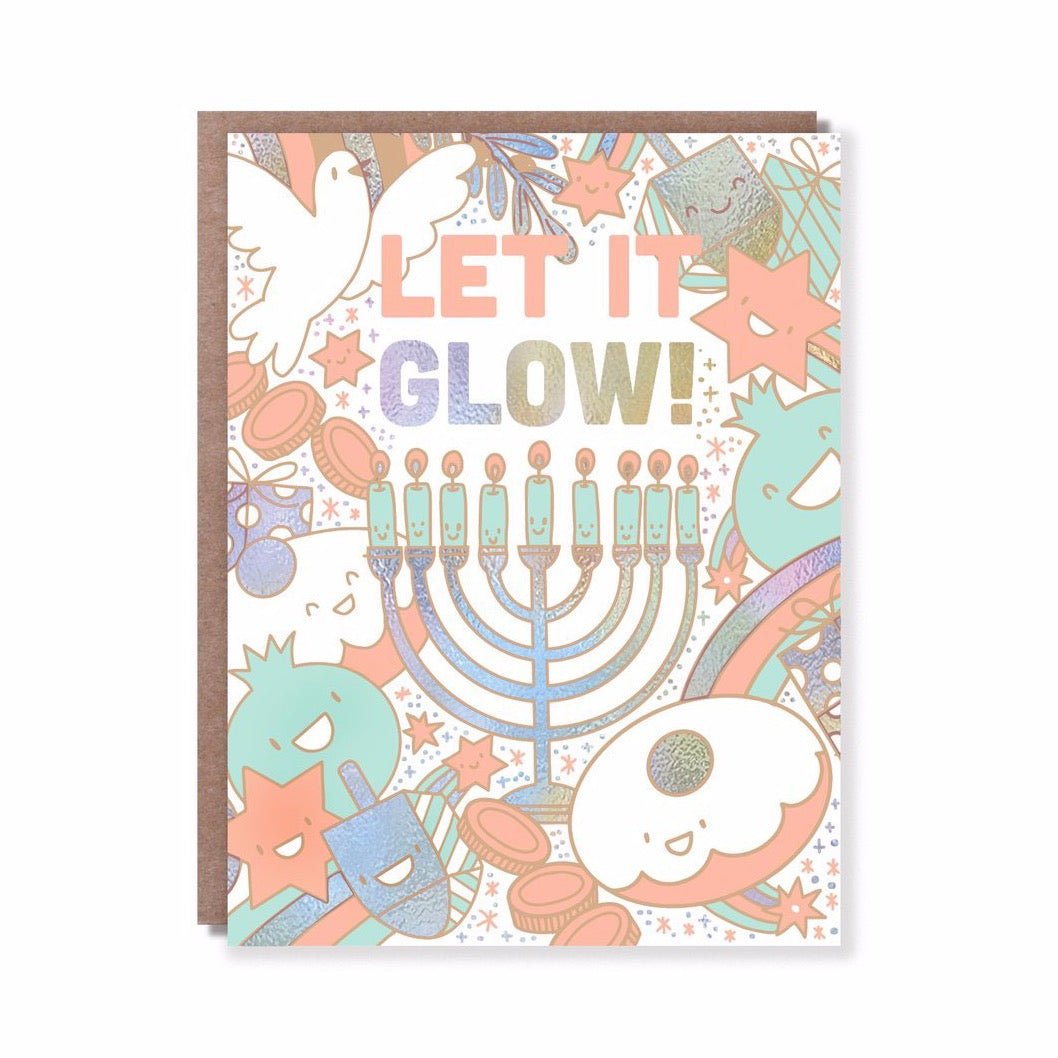 Iridescent card with a menorah surrounded by smiling holiday characters. Front of card reads: "LET IT GLOW!" Card measures 4.25 x 5.5 inches and is designed by Hello! Lucky in San Francisco, CA.