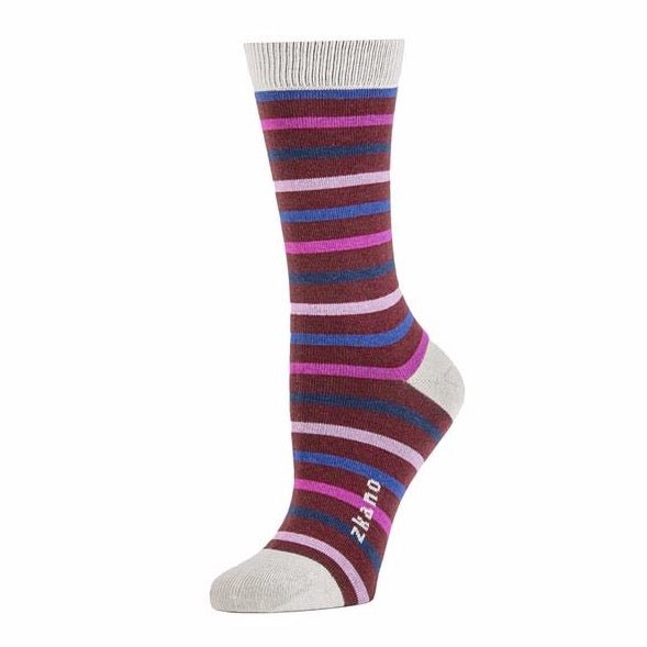Depp red sock with varying shades of blue and pink stripes throughout. Heel, toe and ribbed collar are a light grey, along with the logo along the arch. The Lila Classic Stripe Crew Sock in Merlot is designed by Zkano and made in Alabama, USA.