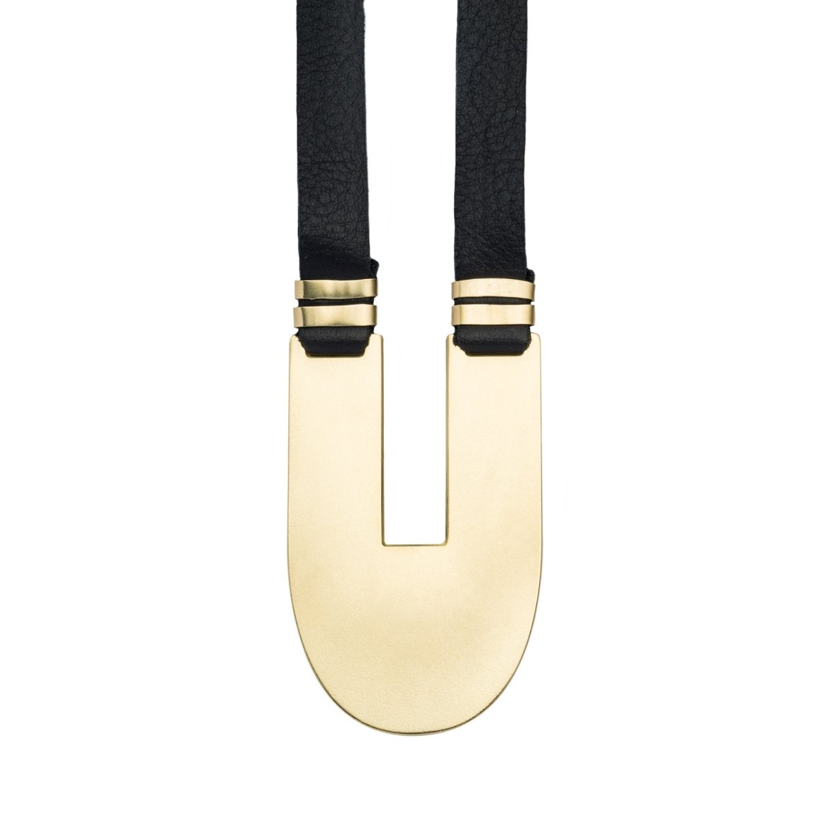 Adjustable, black leather necklace with a sleek, oblong, polished brass statement pendant and brass tubing accents. Hand-crafted in Portland, Oregon.