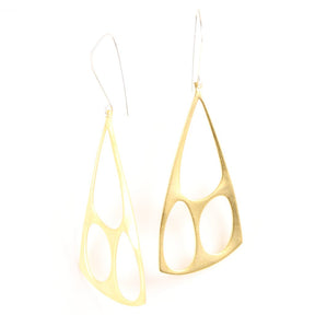 Architectural brass shapes hang from handcrafted silver earring components.