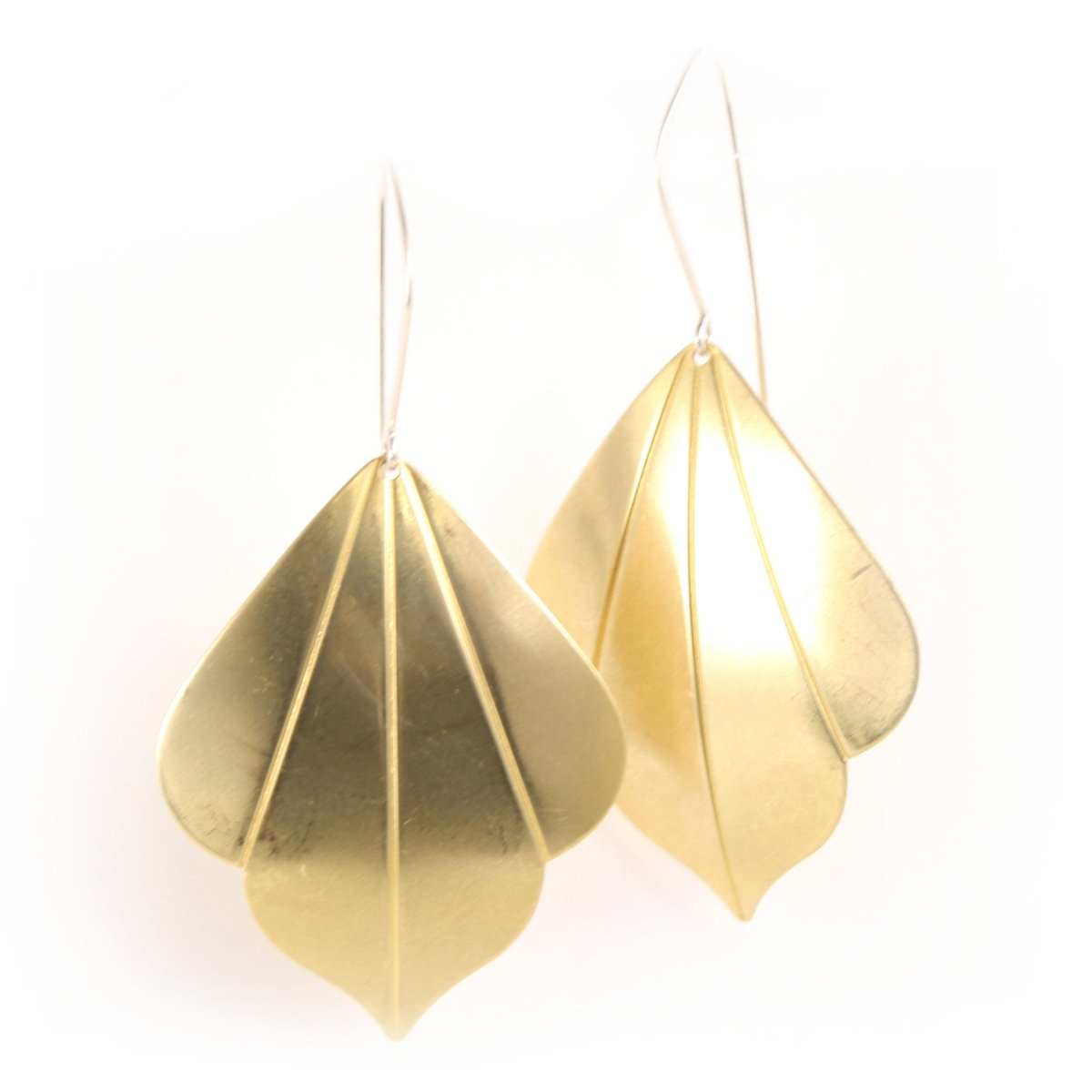 Bright golden deco shapes dangle from silver ear wires.