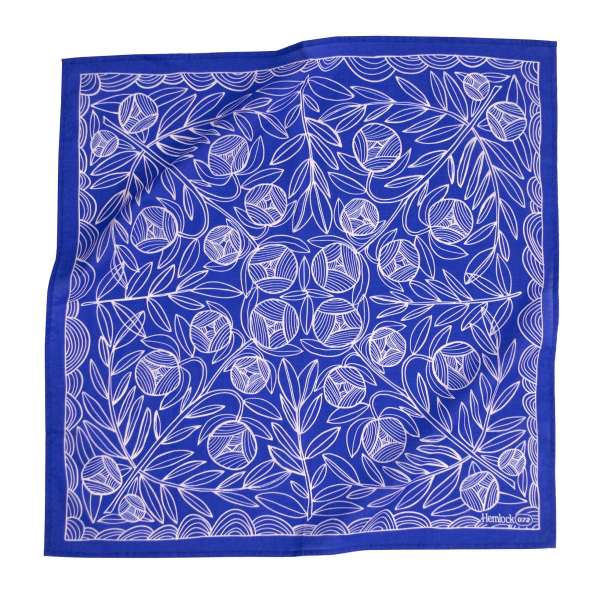 A bright blue bandana with a white floral design. Designed by Hemlock Goods in Fulton, MO and screen printed by hand in India.