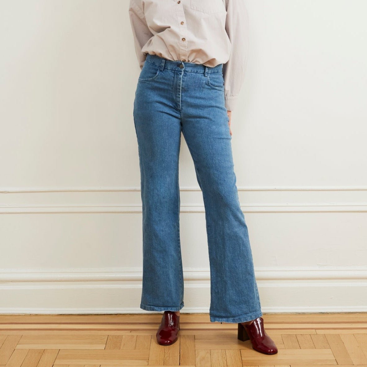 A light blue denim jean with a slight boot flare at the bottom. The Marie Jeans in Light Indigo are designed and made by Loup in New York City, USA.
