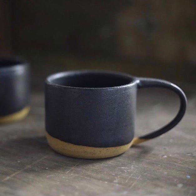 Wheel thrown mug made with speckled stoneware clay and fired with a black matte glaze. Handmade by Amy A Ceramics and handmade in Portland, Oregon.