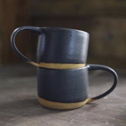 Wheel thrown mug made with speckled stoneware clay and fired with a black matte glaze. Handmade by Amy A Ceramics and handmade in Portland, Oregon.