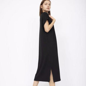 Slightly oversized short sleeve dress with a side slit in Black. Fabric and dress made in Los Angeles, CA by Corinne Collective.