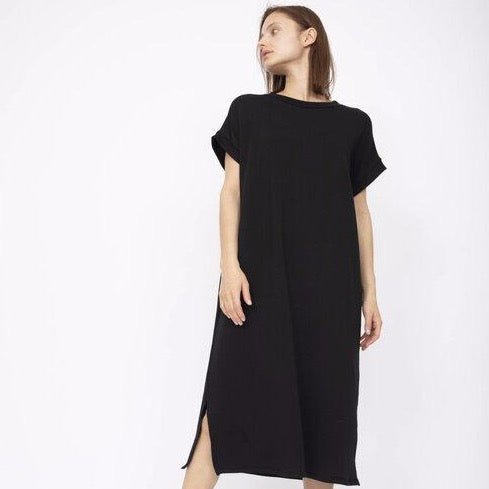 Slightly oversized short sleeve dress with a side slit in Black. Fabric and dress made in Los Angeles, CA by Corinne Collective.