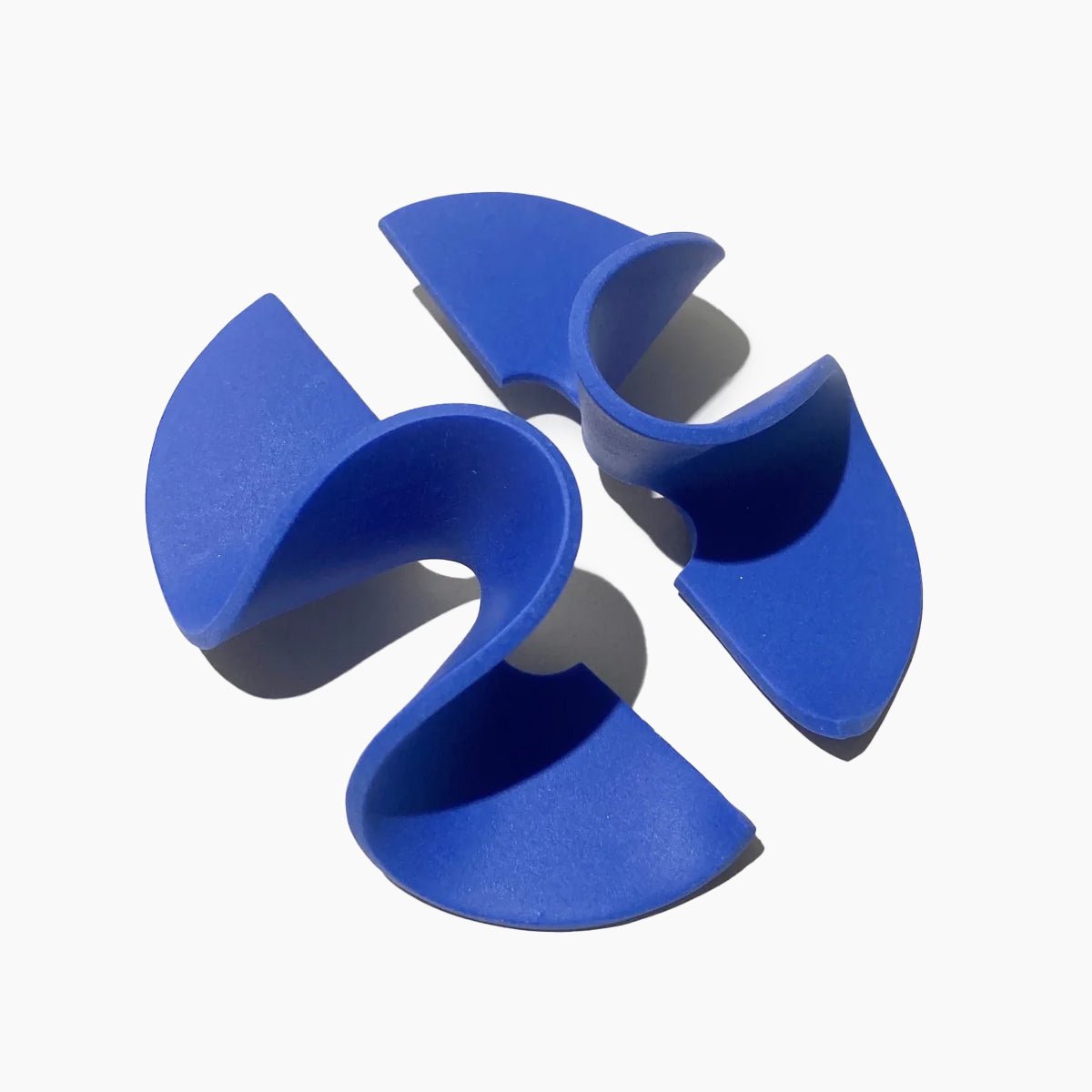A wide band polymer clay stud earring in a wave design. The Modern Wave Earrings in Blue are designed and handcrafted by Little Pieces Jewelry in Los Angeles, California.