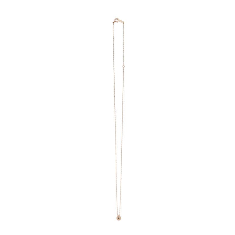 Tiny, circular pendant of 14k yellow gold, with subtle engraved details around a small black diamond, on a 14k gold chain with spring-ring clasp. Hand-crafted in Portland, Oregon. 