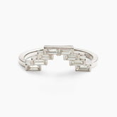 V-shaped geometric Montis stacking ring. Features lab-grown baguette diamonds and 14K recycled white gold.