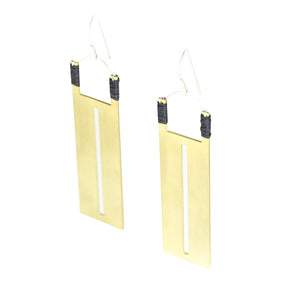 Rectangular brass pendants with thin slit cutouts down the center, accented with gray Japanese cotton thread and sterling silver earring wires. Hand-crafted in Portland, Oregon. 