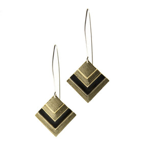 betsy & iya Black Root earrings with gold brass and black chevrons.