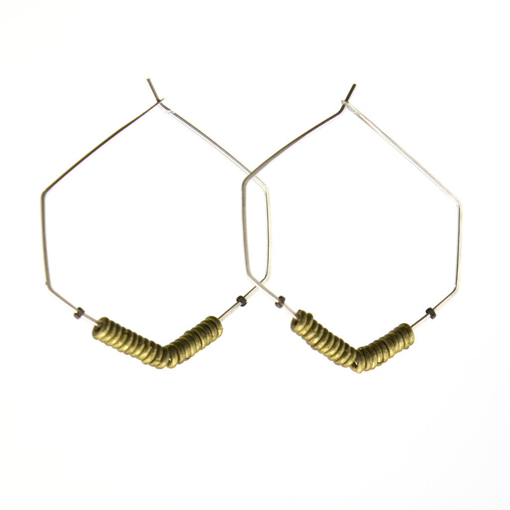 Hexagon shaped hoop earrings with brass beads and silver wires.