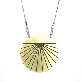 Mid-length simple gold pendant necklace.