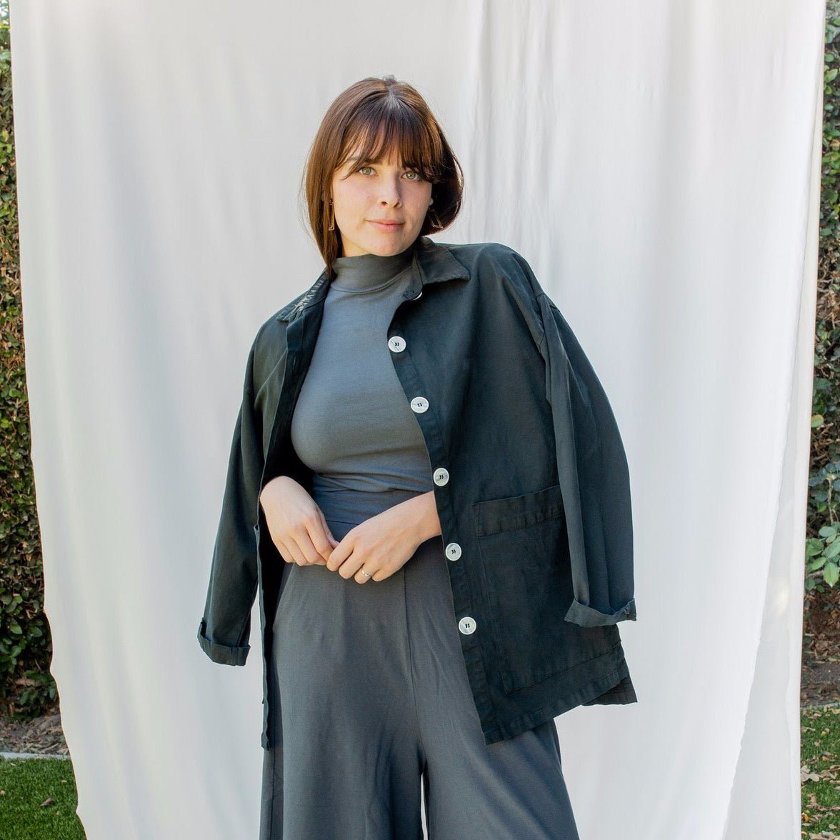 Chore jacket with off-white buttons and two oversized pockets in the color Black Forest. The Painter's Jacket is designed by Mien and made in Los Angeles, CA.