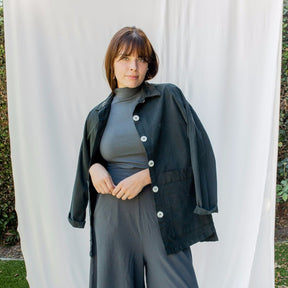 Chore jacket with off-white buttons and two oversized pockets in the color Black Forest. The Painter's Jacket is designed by Mien and made in Los Angeles, CA.