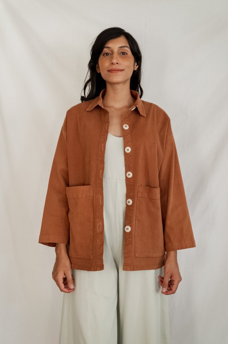 Chore jacket with off-white buttons and two oversized pockets in the color Saddle Brown. The Painter's Jacket is designed by Mien and made in Los Angeles, CA.