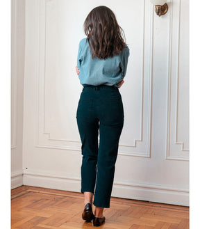 model shows the back side of a straight leg jean in a dark indigo wash. The Parker jeans in Dark Indigo are designed by Loup and made in New York City, USA.