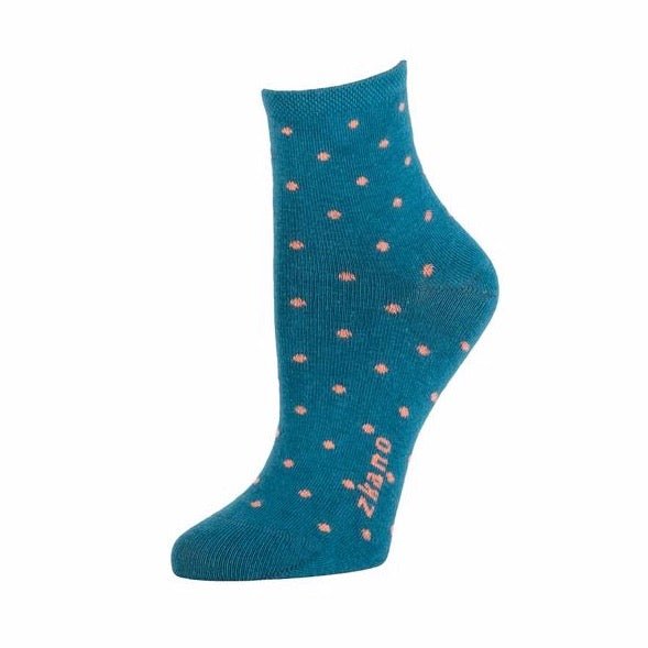 Teal sock with pale orange dots patterned throughout. Zkano logo is dsiplayed along the arch in a pale orange hue. The Polka Dot Anklet in Teal is designed by Zkano and made in Alabama, USA.