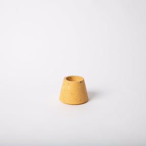 Terrazzo concrete matchstick holder in the shade marigold. Made by Pretti.Cool in Houston, Texas.