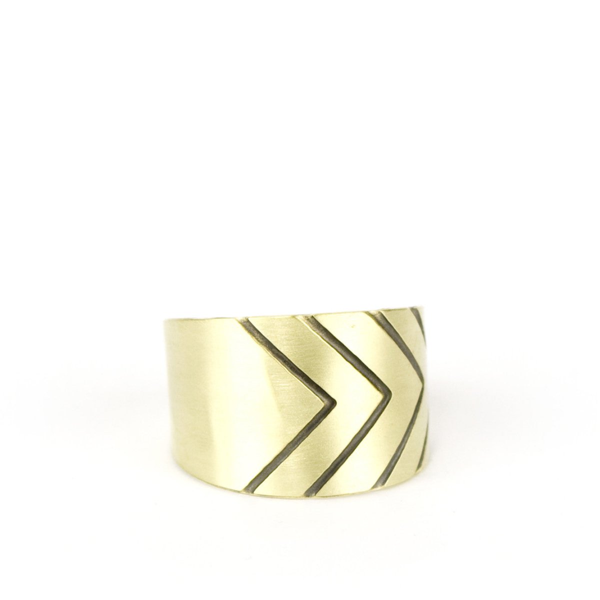 betsy & iya Gold brass band ring with simple black chevron lines on the edge.