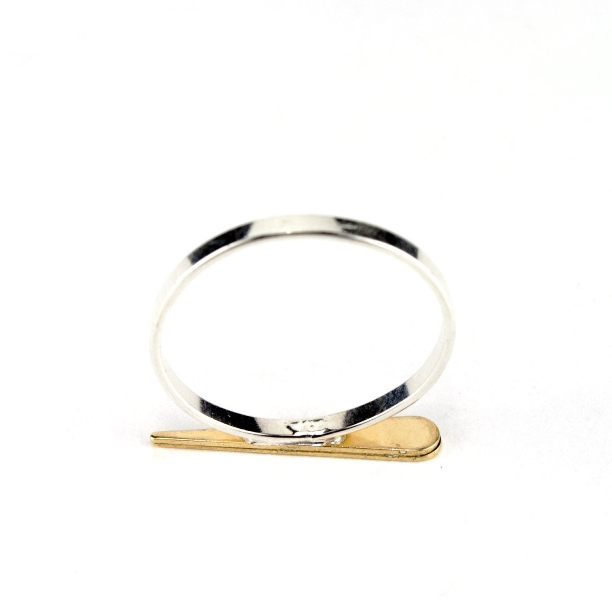 Bottom view of betsy & iya Badlands point ring with gold and sterling silver.