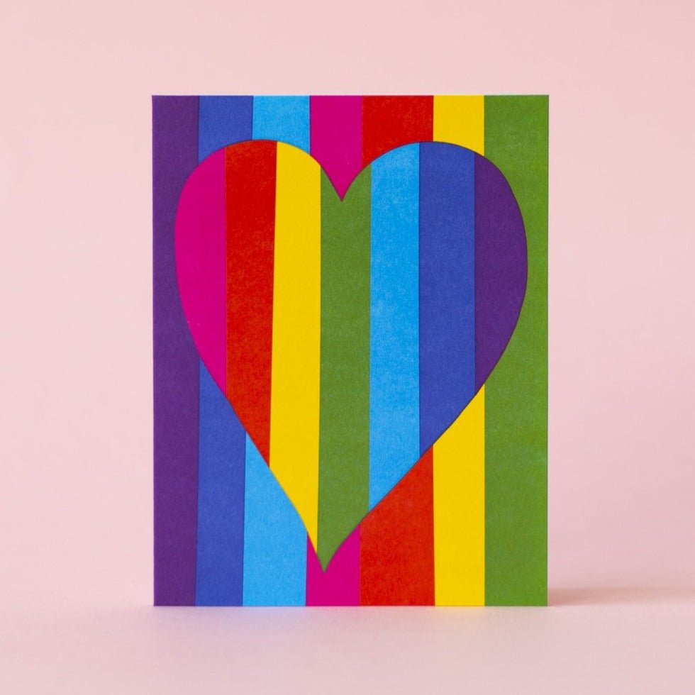 Bright rainbow greeting card with a rainbow patterned heart in the center. Measures 4.25x5.5" and printed in Portland, Oregon.
