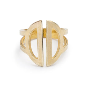 Wide, adjustable, polished brass ring, featuring two triangular cutouts on the band and a pair of semicircle cutouts as the focal point. Hand-crafted in Portland, Oregon. 