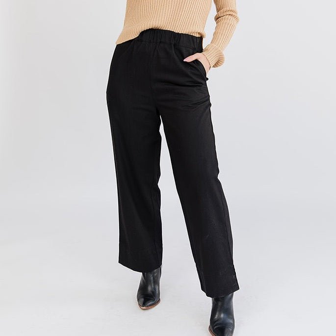 A straight leg loose denim pant in black with an elastic waist. The Rosie Pant in Black Denim is designed by Mata Traders and made in India.