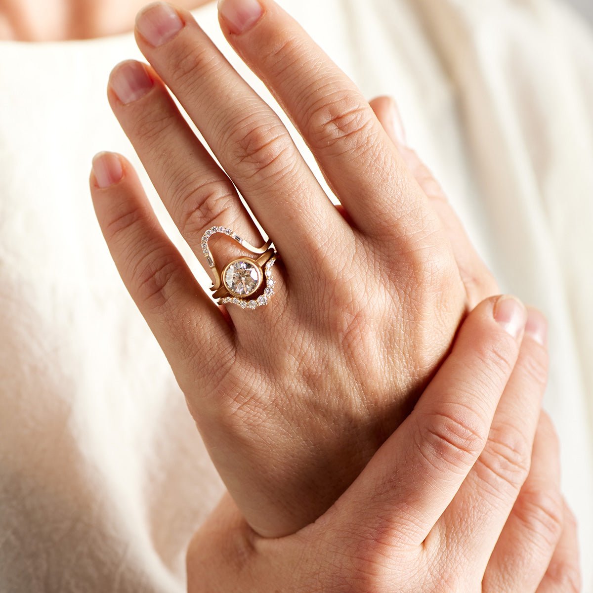 Model wears a stack of the Levo, Salire (2ct) and Ortus rings.