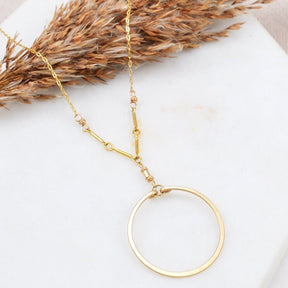 A single gold-fill hoop is suspended by a gold-fill links and chain. The Single Circle Necklace in Gold is designed and handmade by Amy Olson.