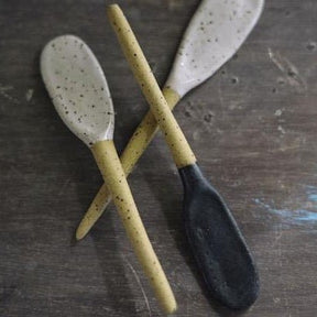 Stirring spoon made with stoneware clay with a matte black finish. Designed and hand built by Amy A Ceramics in Portland, Oregon.
