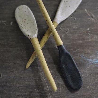 Stirring spoon made with stoneware clay with a glossy white speckled finish. Designed and hand built by Amy A Ceramics in Portland, Oregon.