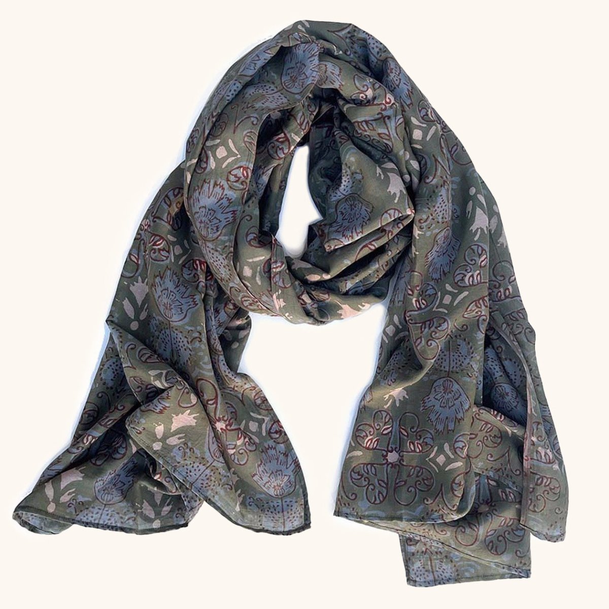 Green, blue, and ivory block printed scarf in a floral pattern. Designed by Ichcha and handmade in India.