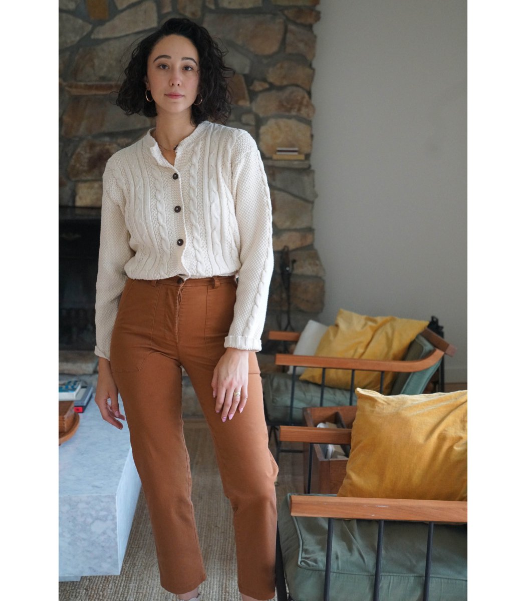 Model wears a straight leg work pant in the shade Tan. The James Pant in Tan is designed by Loup and made in New York City, USA.