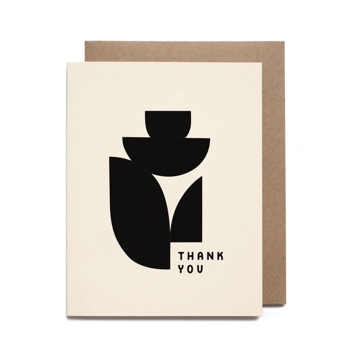 A white greeting card with black shapes. Front of card reads: "THANK YOU." Designed and handcrafted by Worthwhile Paper in Ypsilanti, MI.