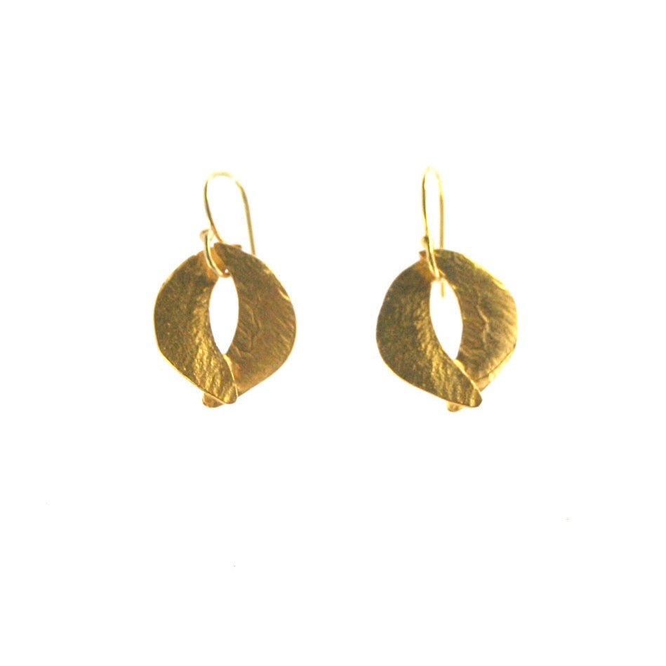 Two crescent shapes come together to form a circular dangle style earring. Made in cast brass and plated in 22kt gold. The Tiny Sculptured Earrings are designed by Lingua Nigra and handcrafted in Chicago, Illinois. 
