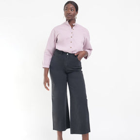 Model wears cropped wide leg jeans in Black. The Toni Jeans in Black are designed by Loup and made in New York City, USA.