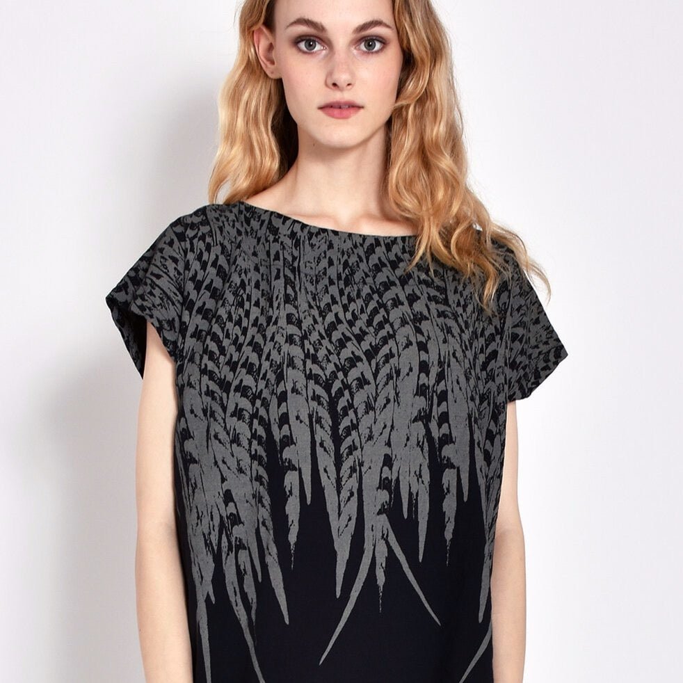 Short sleeve black tunic with grey feather design. Designed and sewn by Uzi in Brooklyn, New York.
