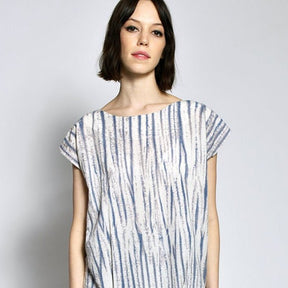 Short sleeve tunic with violet and cream rippled tie dye effect. The Tunic in Tiger Tie Dye is designed and sewn by Uzi in Brooklyn, New York City.