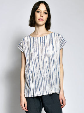 Short sleeve tunic with violet and cream rippled tie dye effect. The Tunic in Tiger Tie Dye is designed and sewn by Uzi in Brooklyn, New York City.