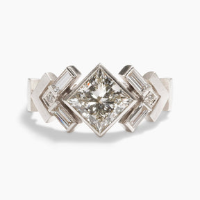 Geometric Uro ring with lab-grown princess cut diamond center. Chevron motif band in 14K recycled white gold.