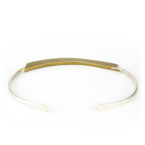 Sterling banded cuff bracelet with bronze focal piece.