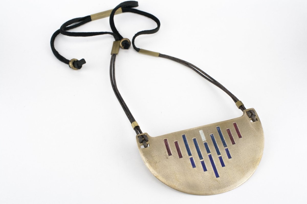 Colorful bronze painted necklace with leather details.