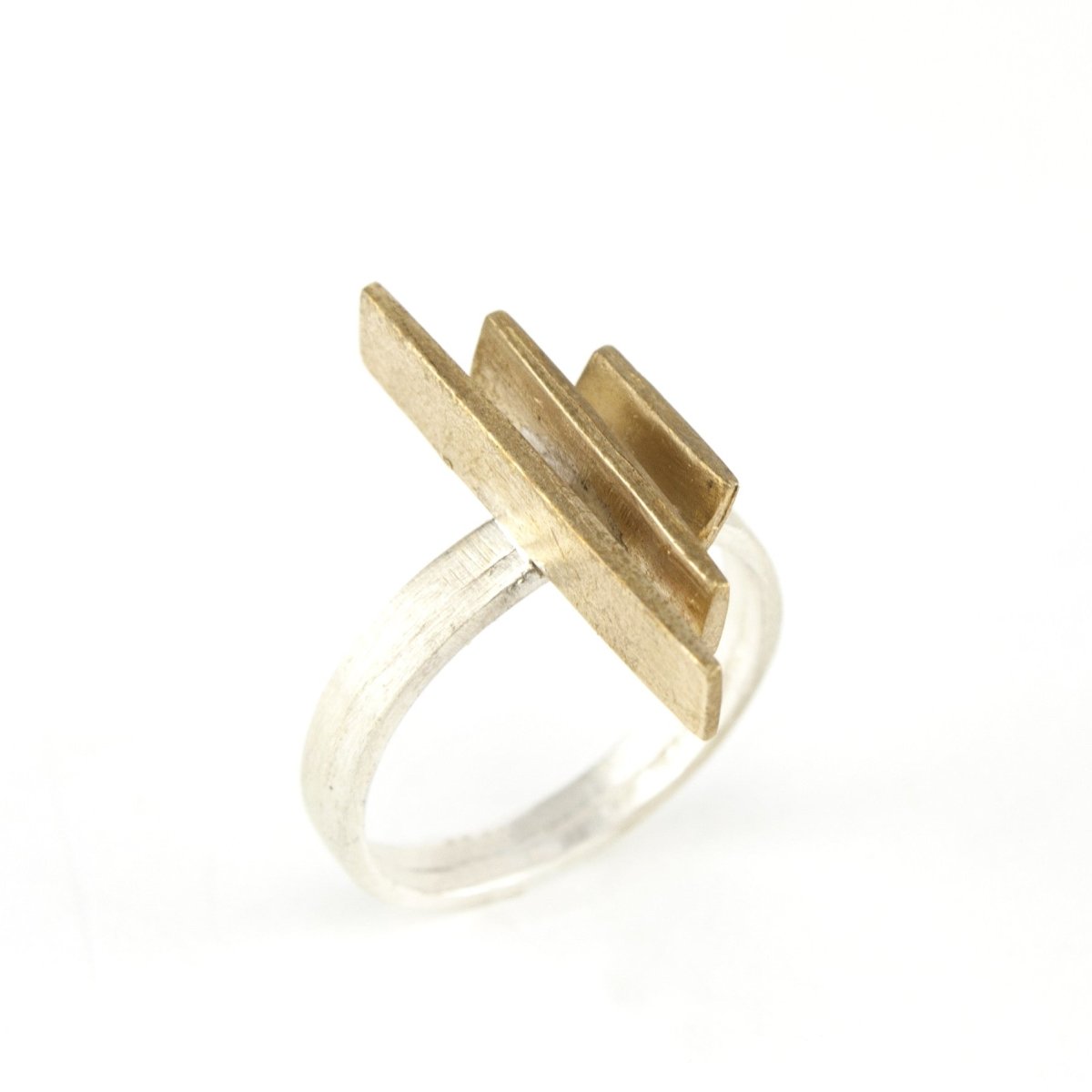 Silver ring with linear bronze bars.