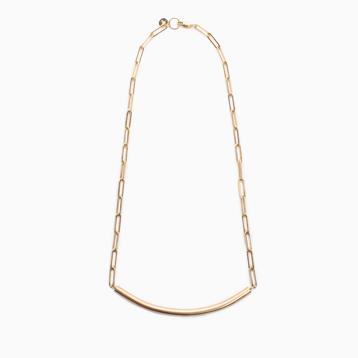 A gold fill chain necklace with a cylindrical curved focal bar. The Virada Necklace is Designed and handcrafted in Portland, Oregon.