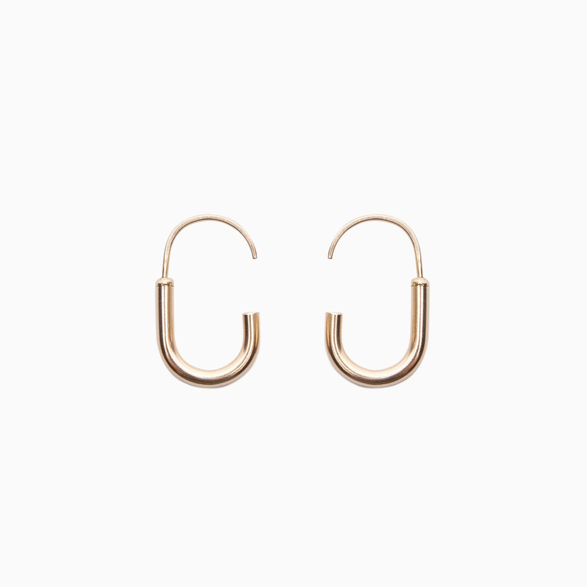 A mini gold-fill hoop U-shaped earring with an arched gold-fill ear wire with a slight opening. Designed and handcrafted in Portland, Oregon.
