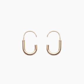 A mini gold-fill hoop U-shaped earring with an arched gold-fill ear wire with a slight opening. Designed and handcrafted in Portland, Oregon.