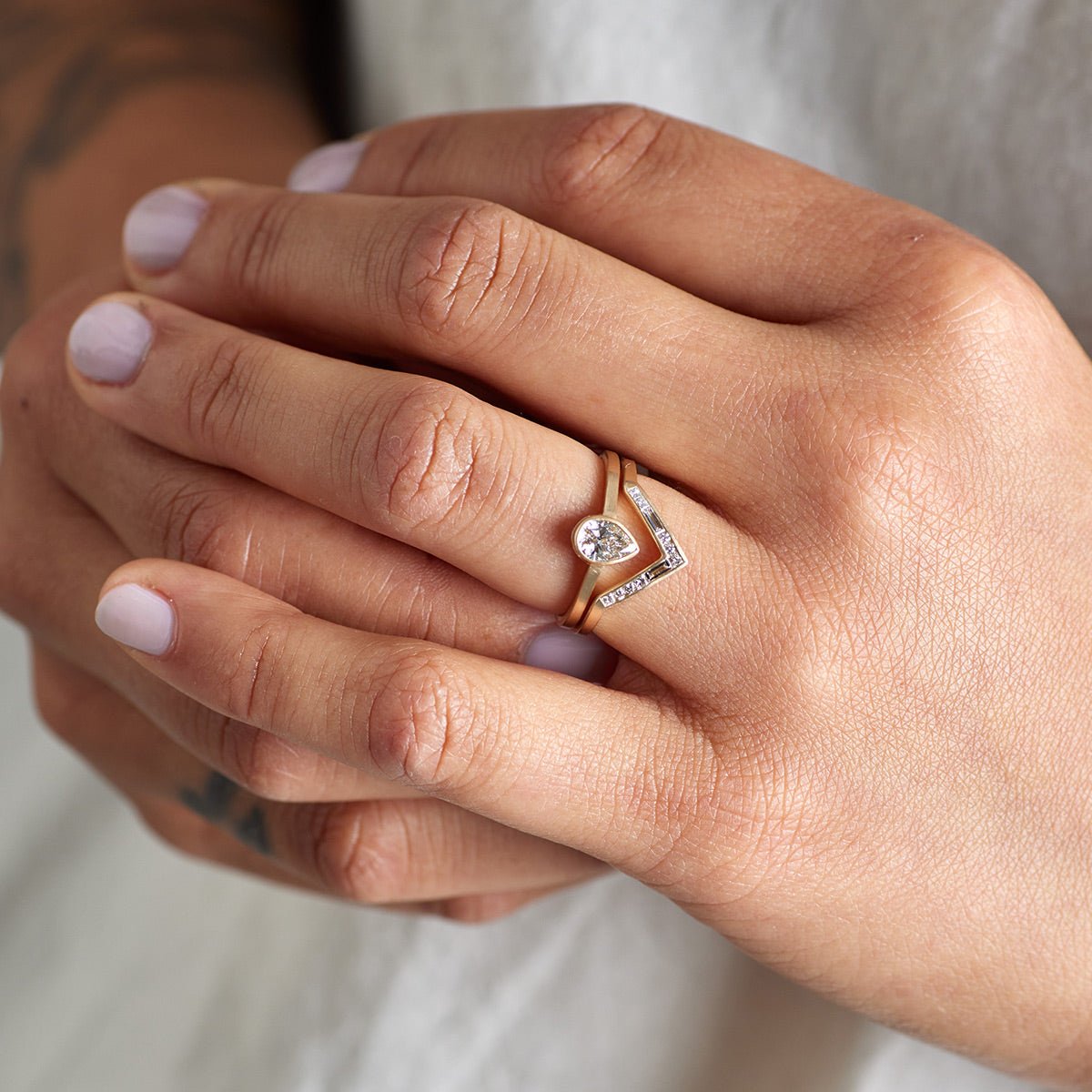Model wears the Votum ring stacked on top of the Altus ring. Designed and made in Portland, Oregon.